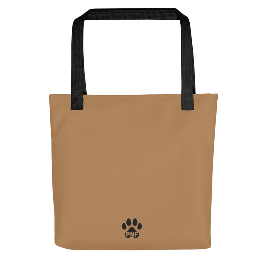 Brown tote bag with black paw print logo and straps on a white background