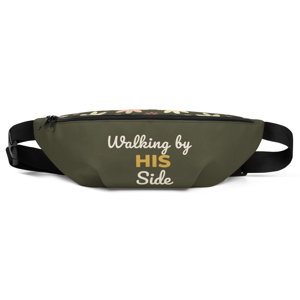 Front view of an olive green fanny pack with the phrase, " Walking by HIS side" on the front and on the top is floral pattern.
