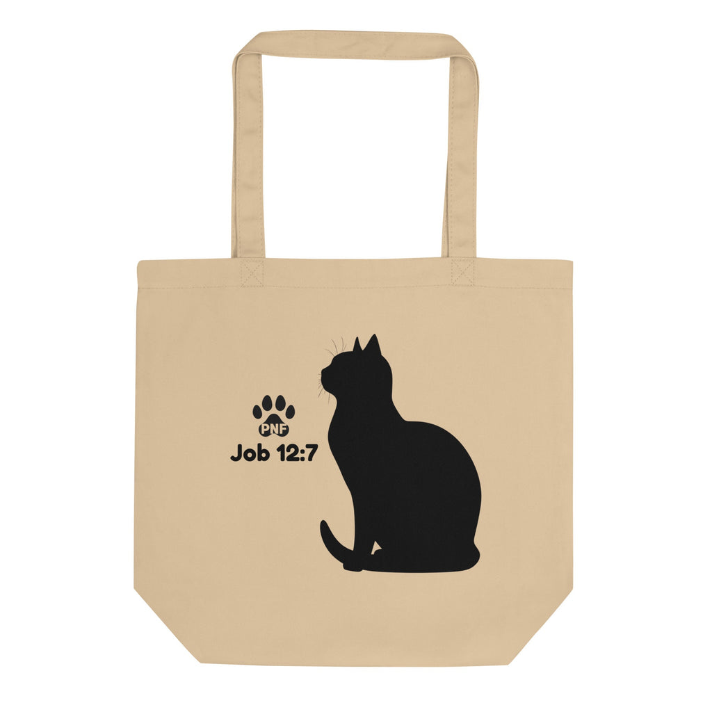 Flat lay image of a canvas colored tote bag with a silhouette of a black cat with the scripture of Job 12:7.