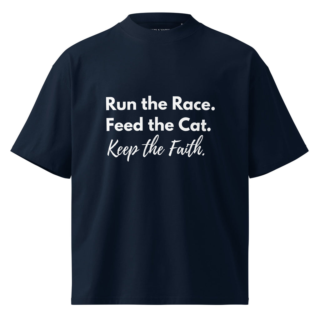 Navy blue oversized organic t-shirt with the words, " Run the Race. Feed the Cat. Keep the Faith." in white text.