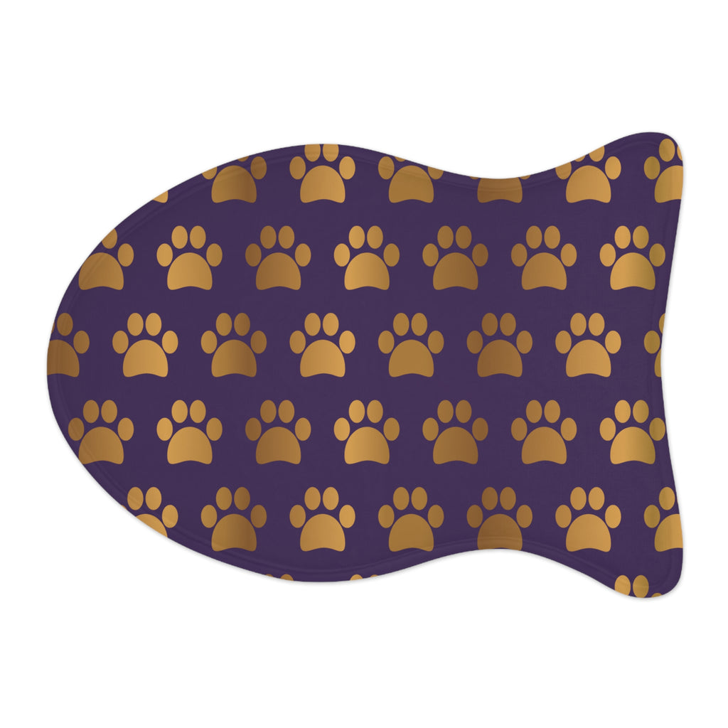 Fish‑shaped plush pet feeding mat in dark purple with gold heart‑of‑paw‑prints graphic 
