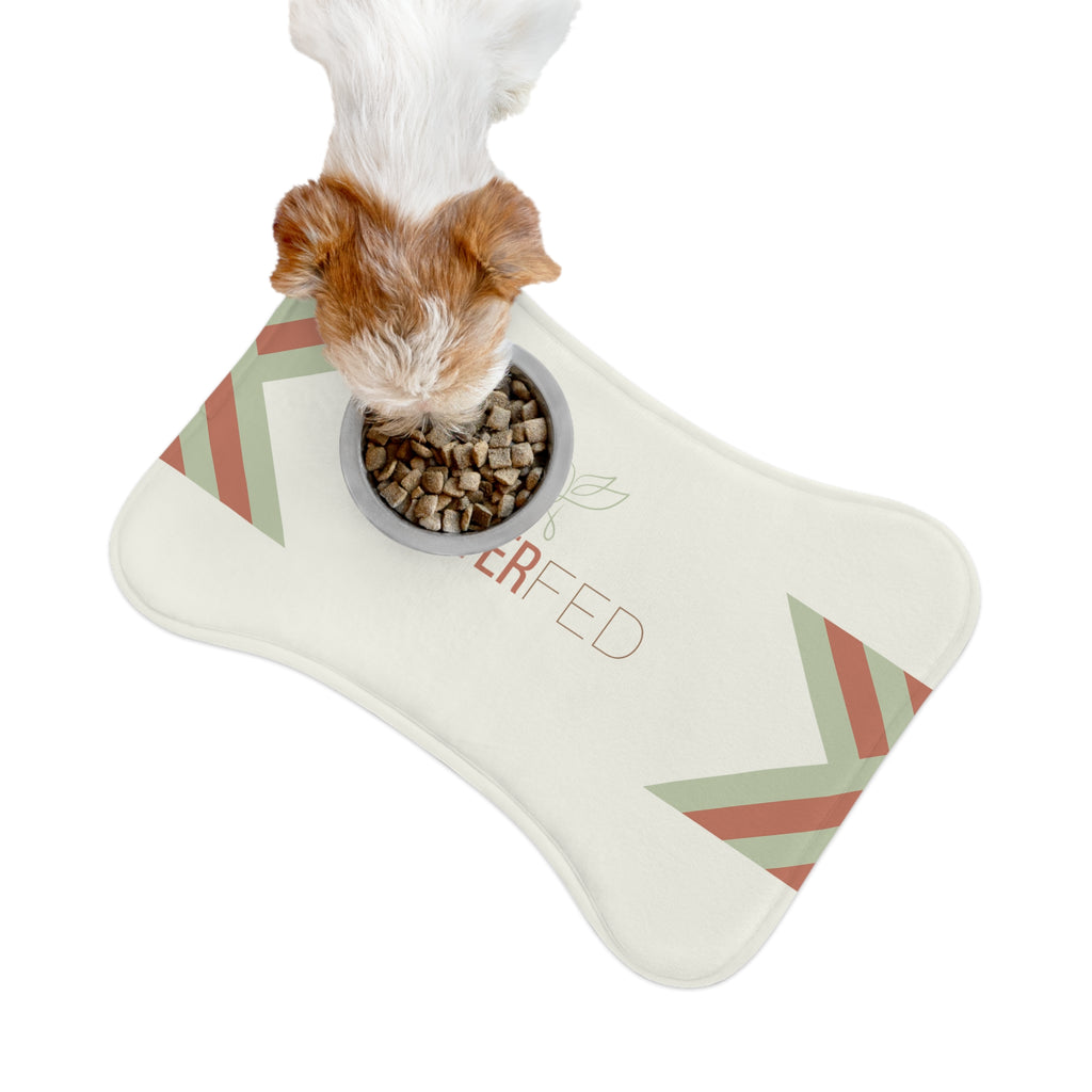 Bone-shaped plush pet feeding mat with cream background, geometric side patterns in muted sage and rust, and “Forever Fed” text with minimalist dove graphic in the center.