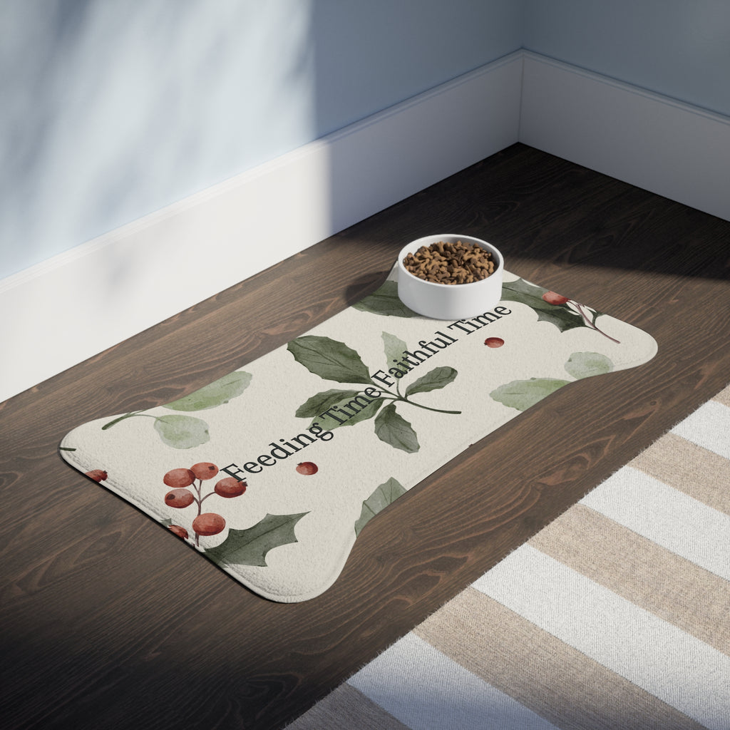 Bone‑shaped plush pet feeding mat in dark purple with gold heart‑of‑paw‑prints graphic and text “Risen Love Renewed Paw”