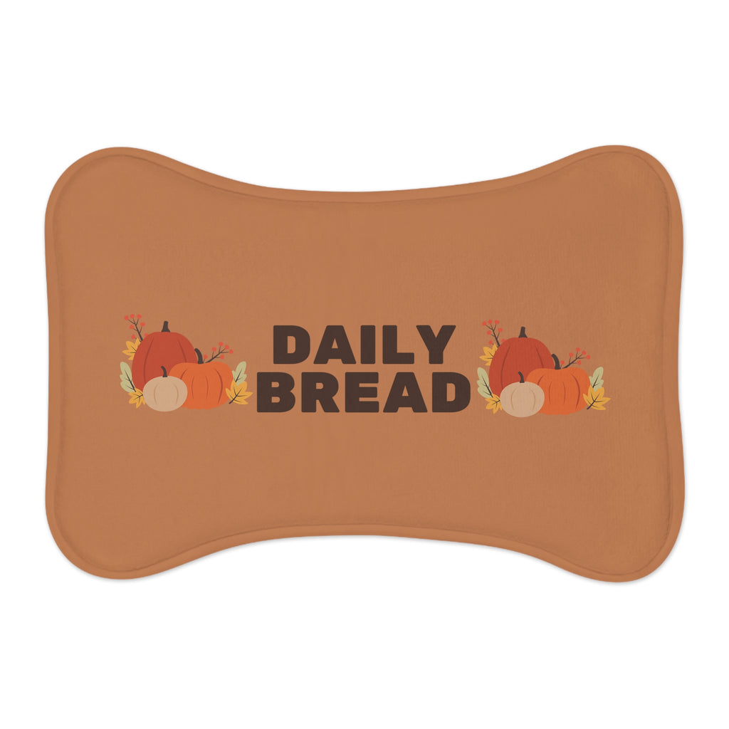 Flat lay of a Fall Harvest Pumpkin pet food mat with colorful leaves and pumpkin design.