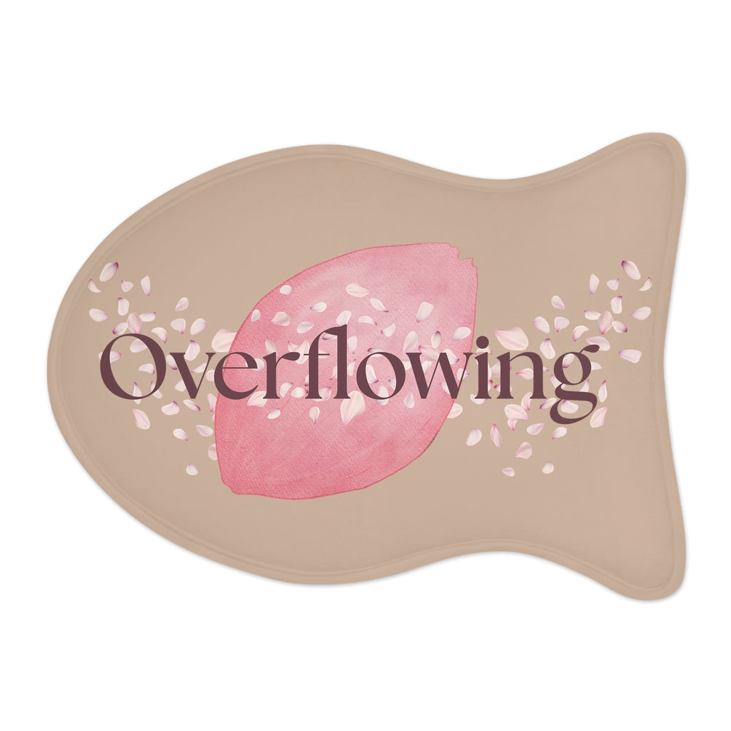 Overhead view of rose petal designed fish-shaped “Overflowing” pet feeding mat