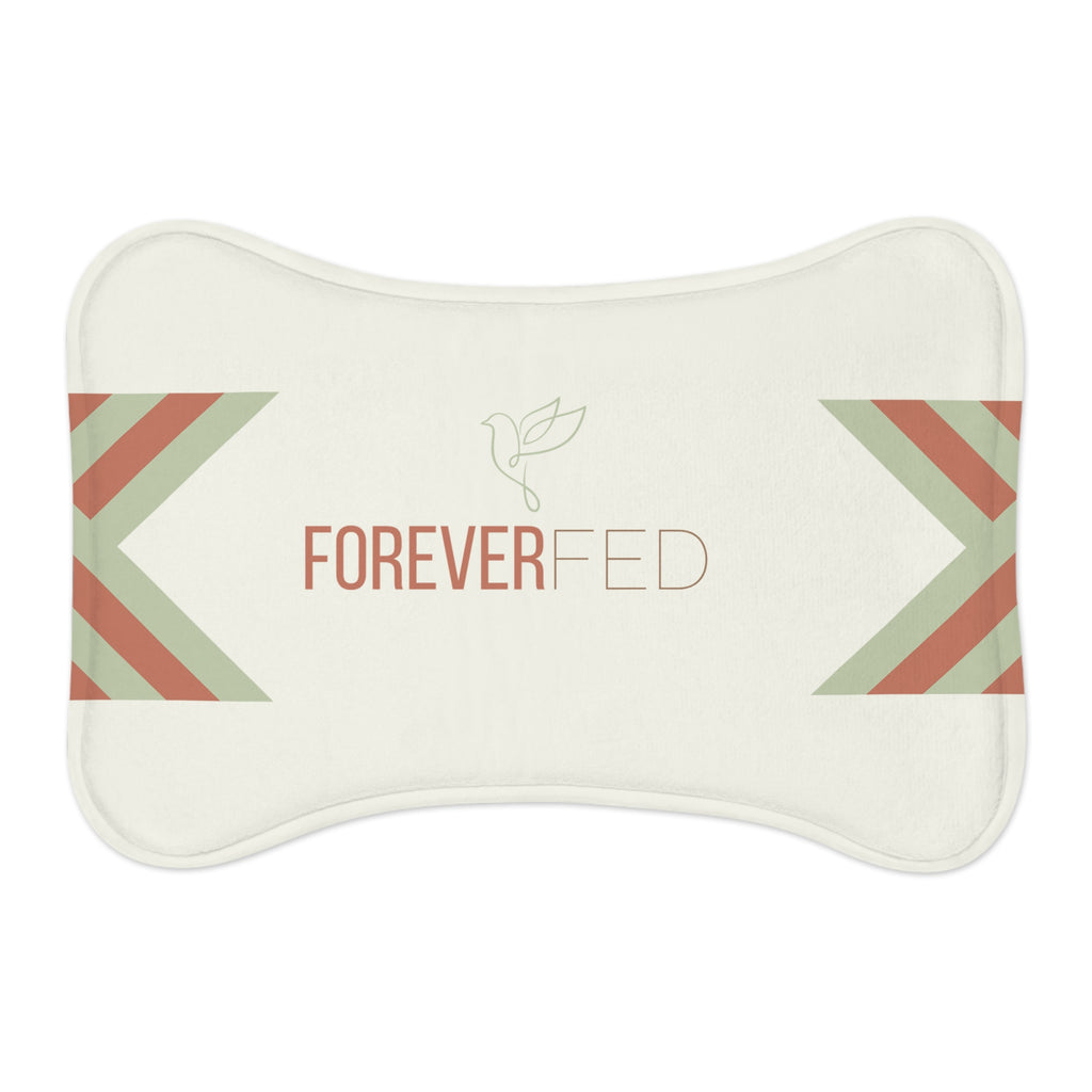 Bone-shaped plush pet feeding mat with cream background, geometric side patterns in muted sage and rust, and “Forever Fed” text with minimalist dove graphic in the center.