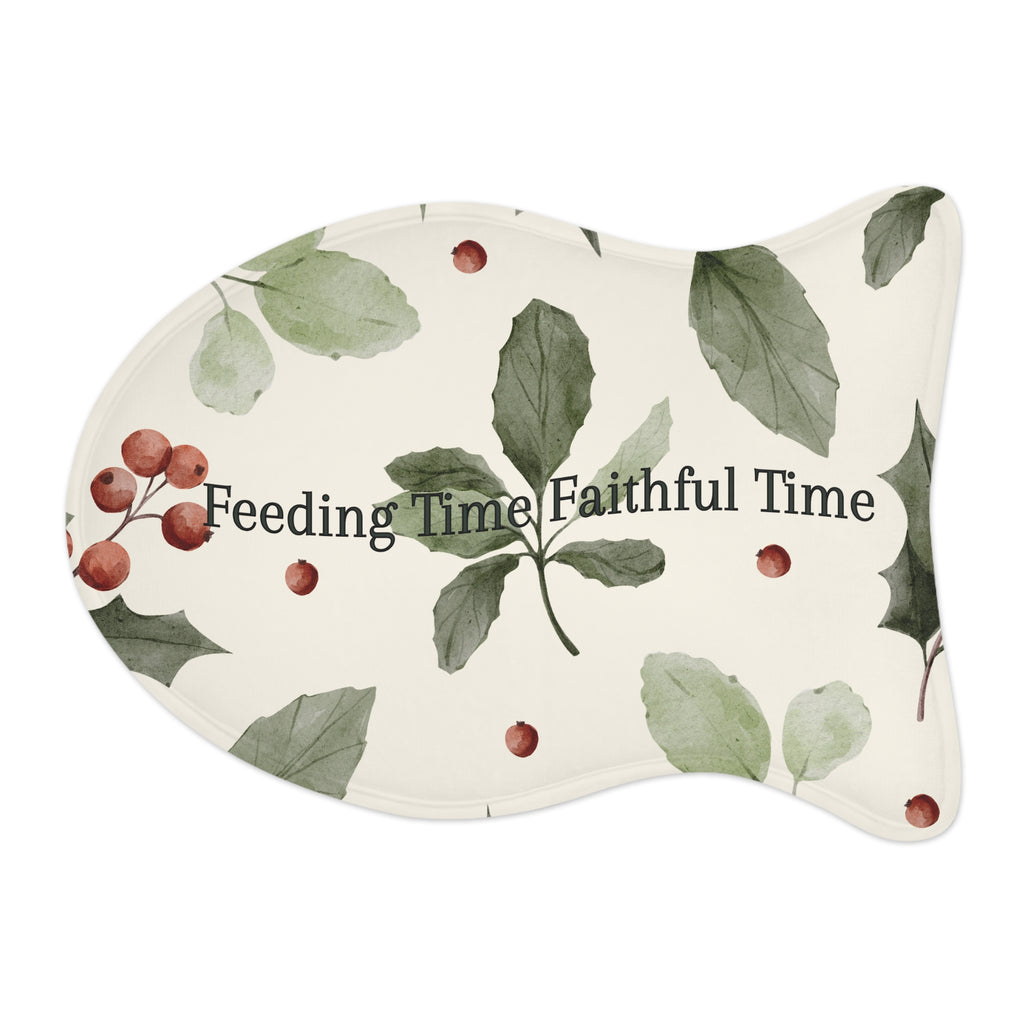 Fish‑shaped plush pet feeding mat in dark purple with gold heart‑of‑paw‑prints graphic and text “Risen Love Renewed Paw”