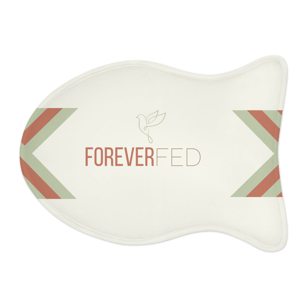 Fish-shaped plush pet feeding mat with cream background, geometric side patterns in muted sage and rust, and “Forever Fed” text with minimalist dove graphic in the center.