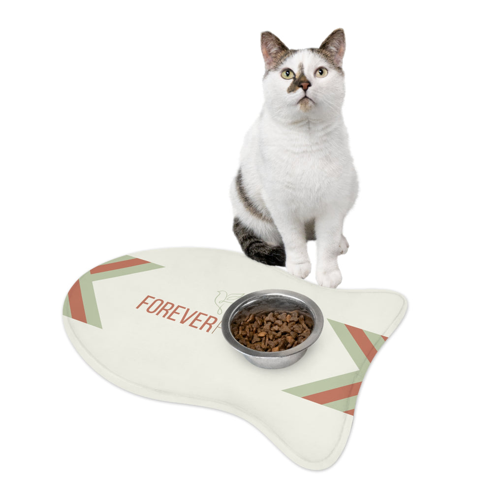 Fish-shaped plush pet feeding mat with cream background, geometric side patterns in muted sage and rust, and “Forever Fed” text with minimalist dove graphic in the center.