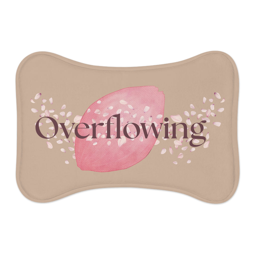 Overhead view of rose petal designed bone-shaped “Overflowing” pet feeding mat