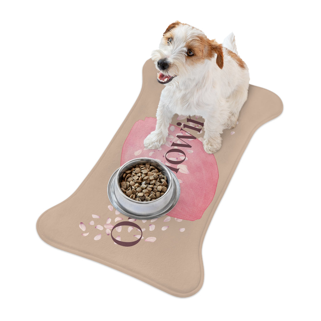 Small dog eating kibble from a bowl placed on rose petal designed “Overflowing” pet feeding mat