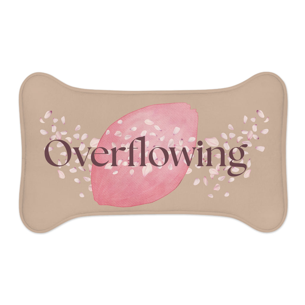 Overhead view of rose petal designed bone-shaped “Overflowing” pet feeding mat