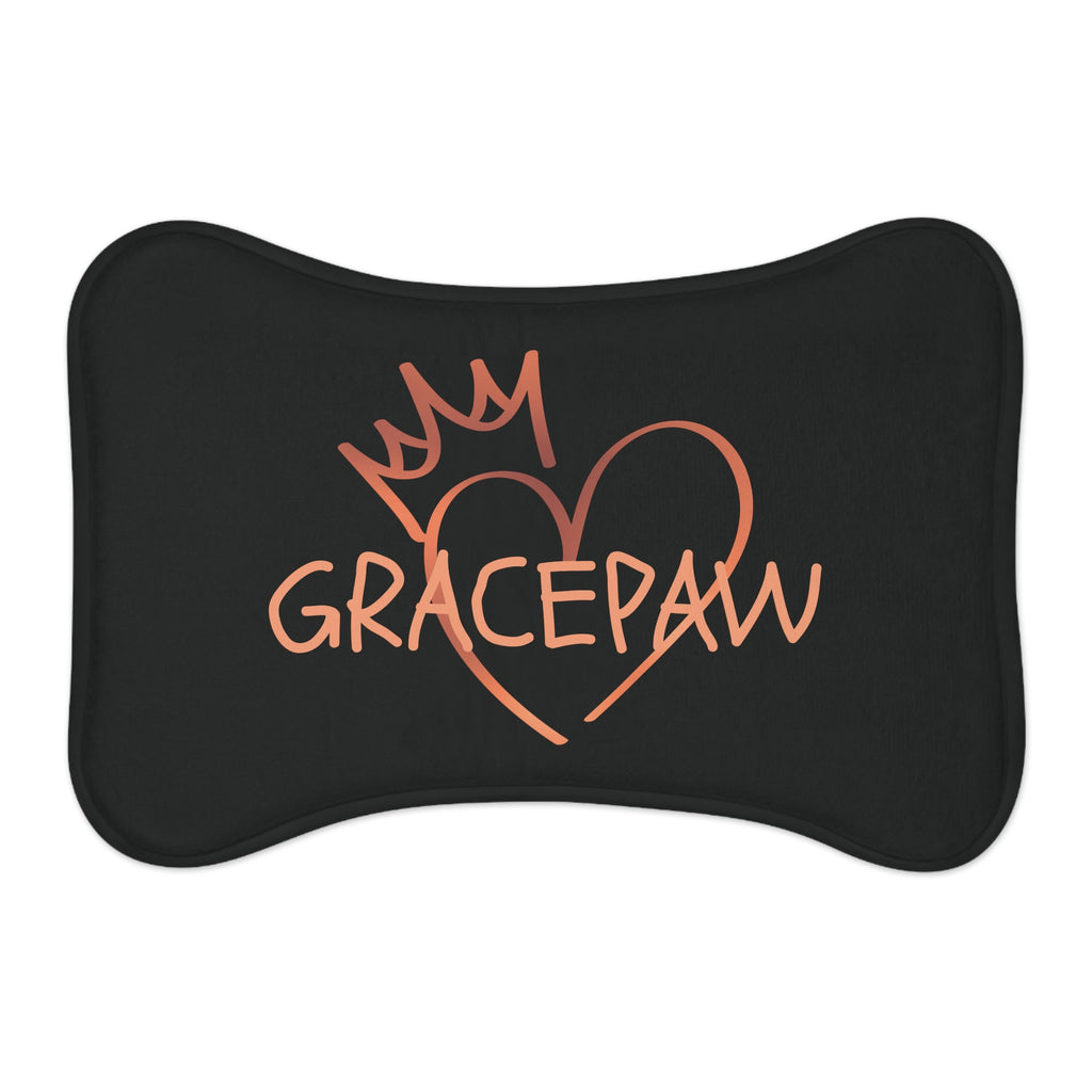 Black bone-shaped pet feeding mat with a heart and crown graphic and the word “GRACEPAW” in peach lettering, designed for comfort and non-slip functionality.