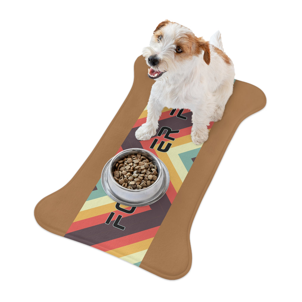 Brown and white dog sitting next to “Forever Fed” retro-style pet feeding mat with food bowl.