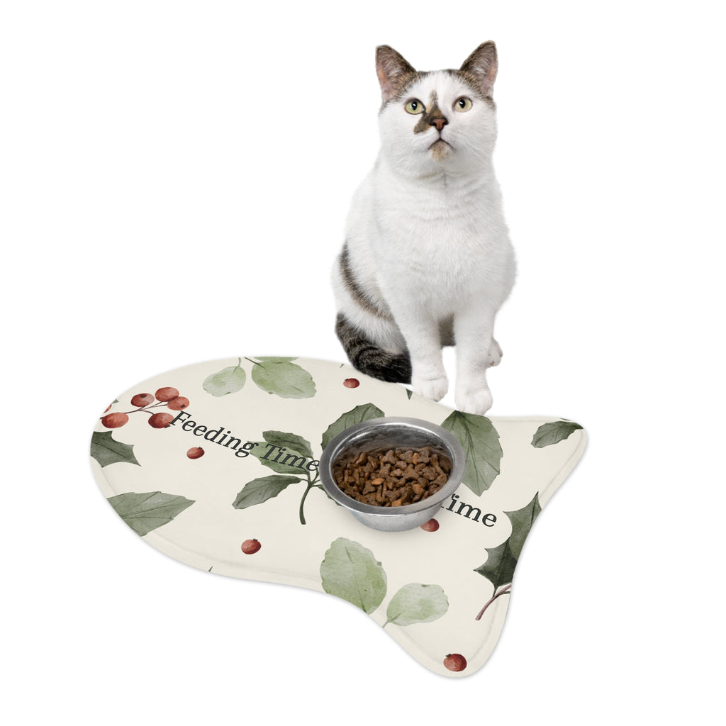 Fish‑shaped plush pet feeding mat in dark purple with gold heart‑of‑paw‑prints graphic and text “Risen Love Renewed Paw”