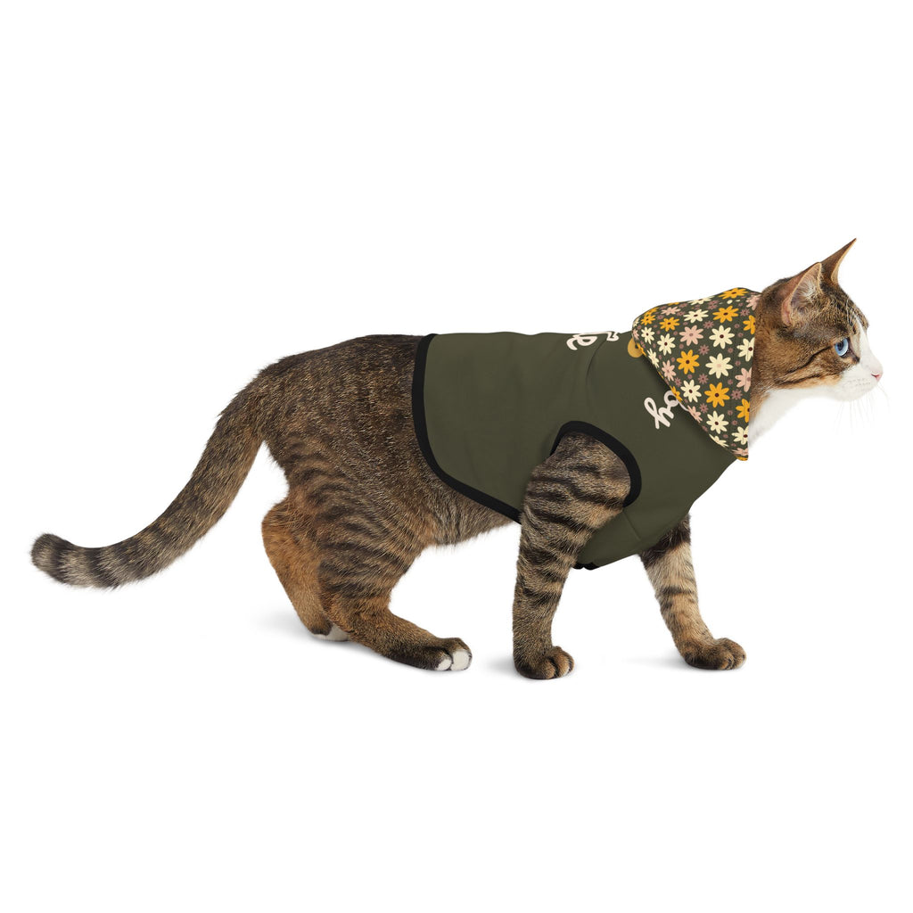 Side view of a brown cat wearing an olive green pet hoodie with the words, " Walking by HIS Side" with a  floral print hoodiec