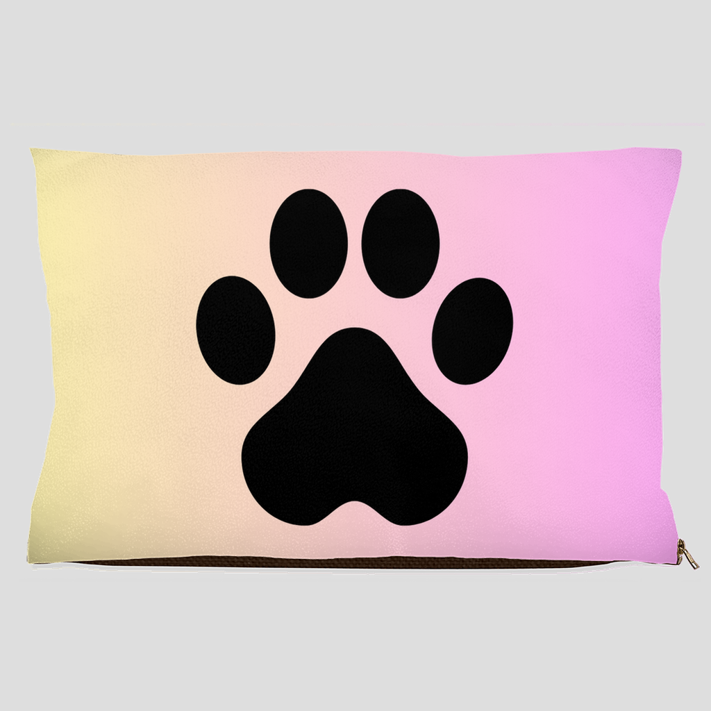 Pet bed with black paw print on pastel cream to pink gradient background