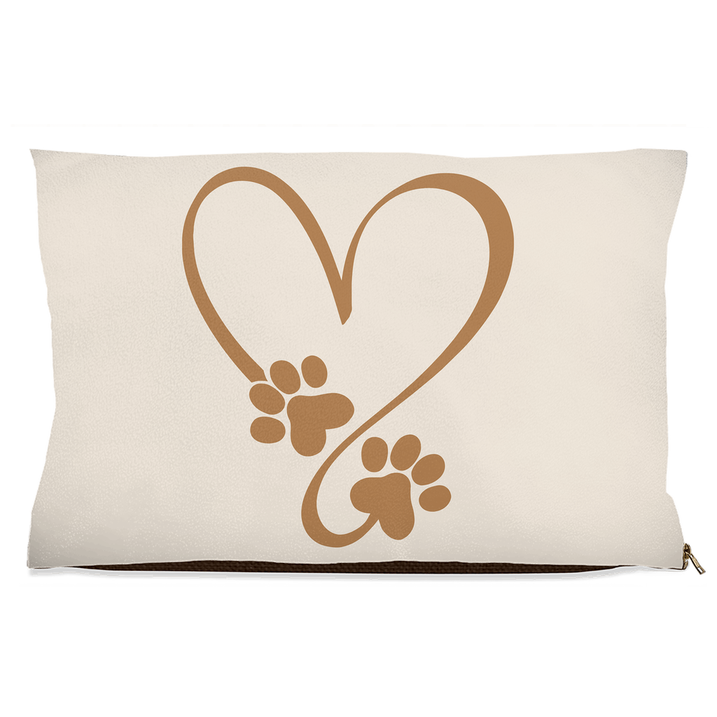 Beige pillow with brown heart and paw prints design on a white background