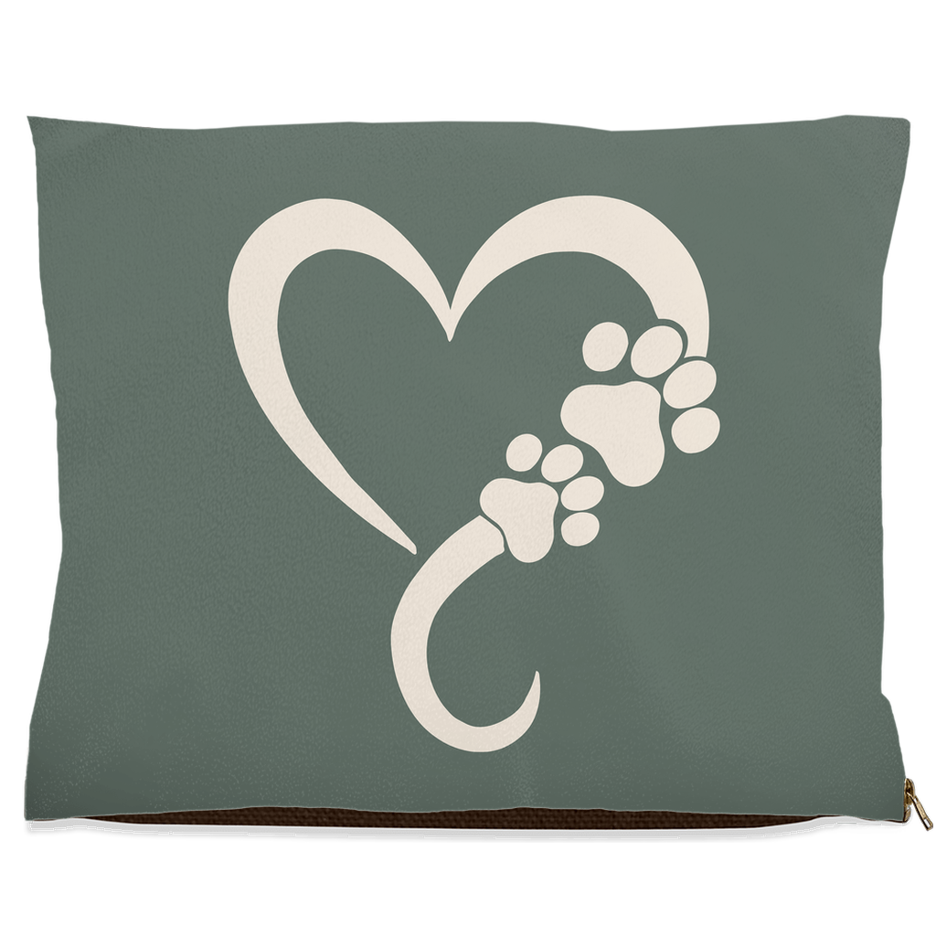 Sage green pillow with a white heart and paw print design on a white background