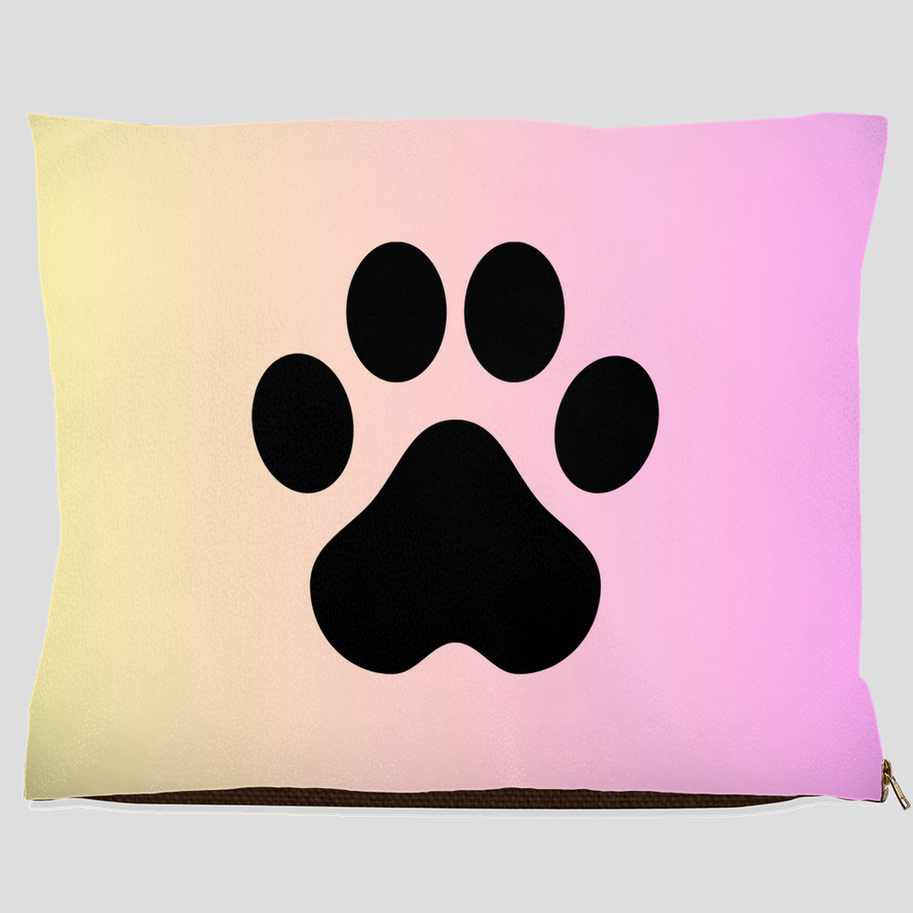 Pet bed with black paw print on pastel cream to pink gradient background