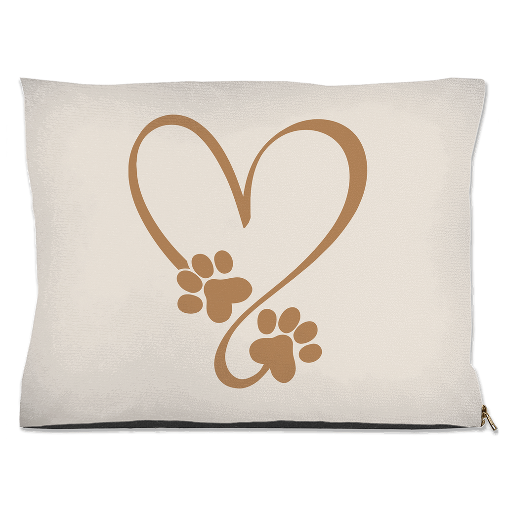 Beige pillow with brown heart and paw prints design on a beige background