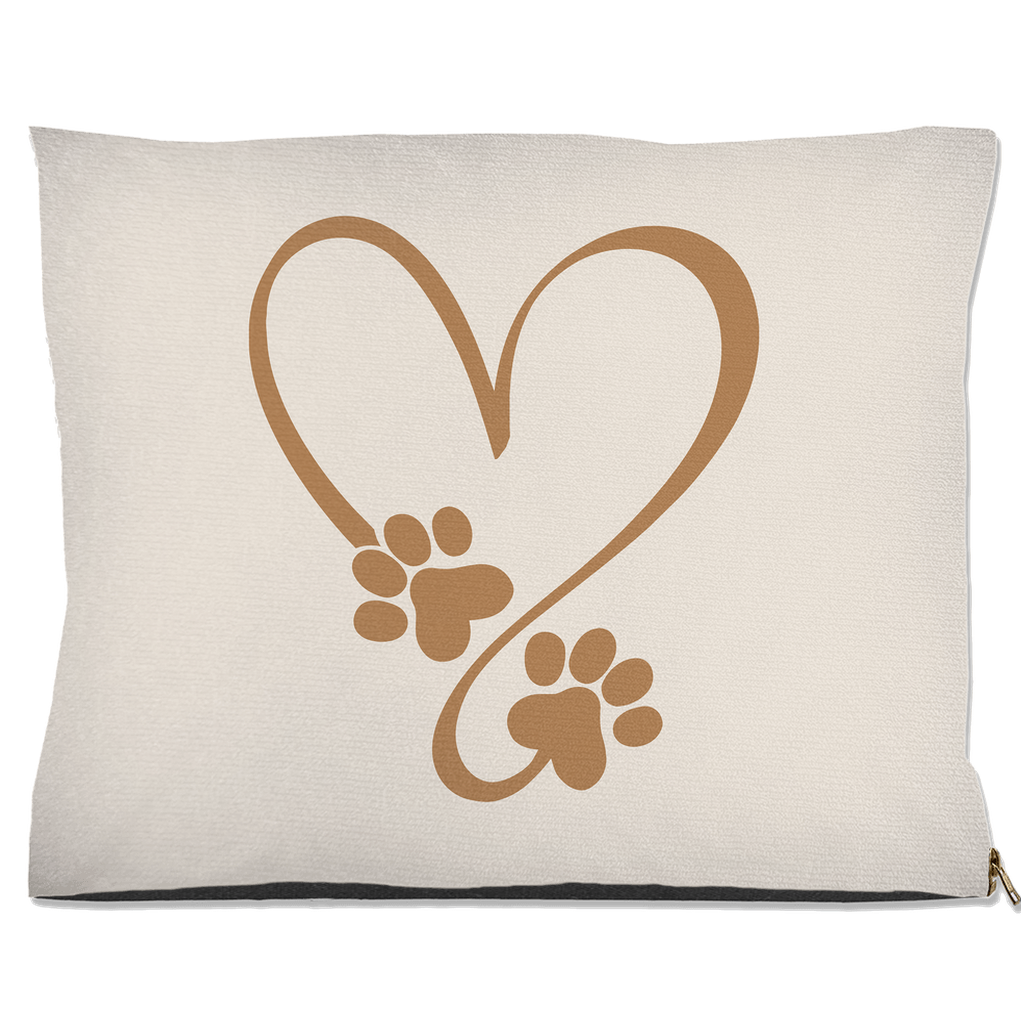 Beige pillow with brown heart and paw prints design on a white background
