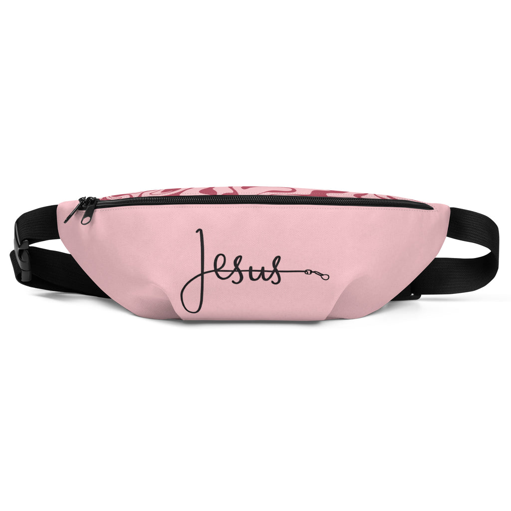 Pink fanny pack featuring the word ‘Jesus’ in black cursive with a leash-style design, faith-inspired accessory