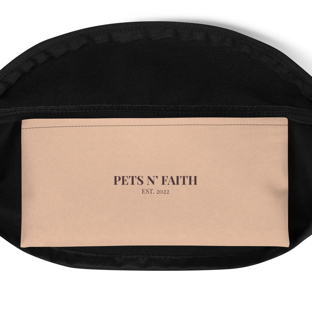 Inside view of peach beige fanny pack with “PETS N’ FAITH EST. 2022” text printed on the inner pocket.