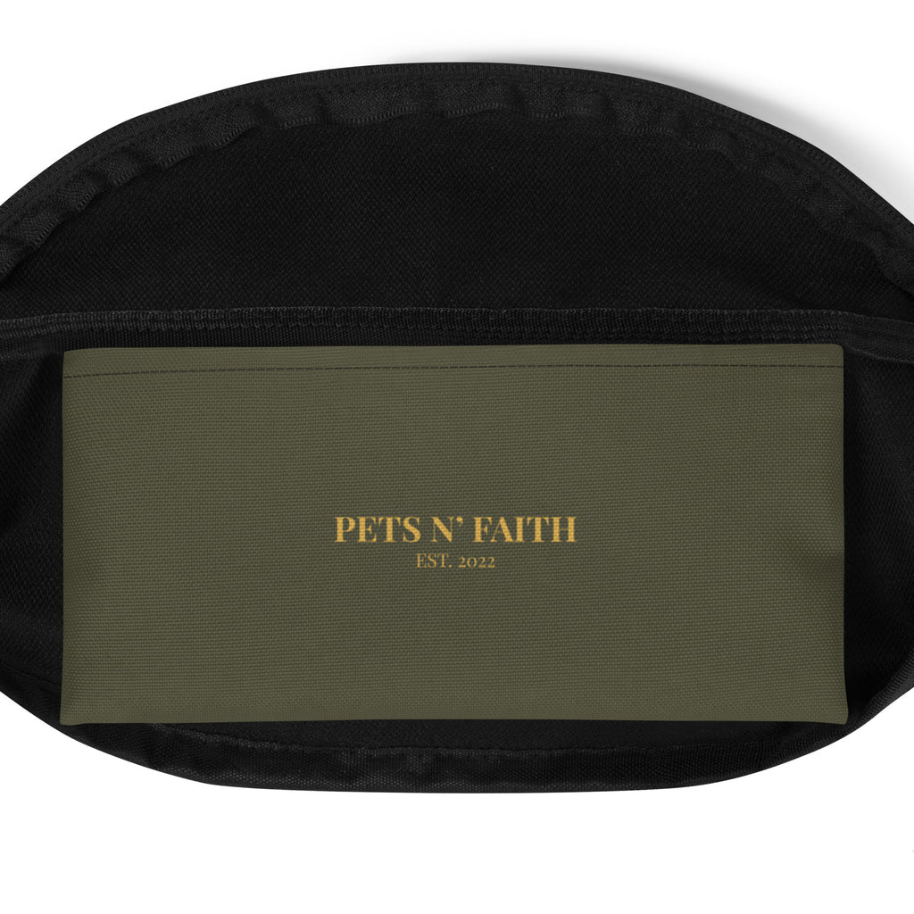 Interior view of olive green fanny pack featuring Pets N’ Faith Est. 2022 label in warm gold on inside pocket.