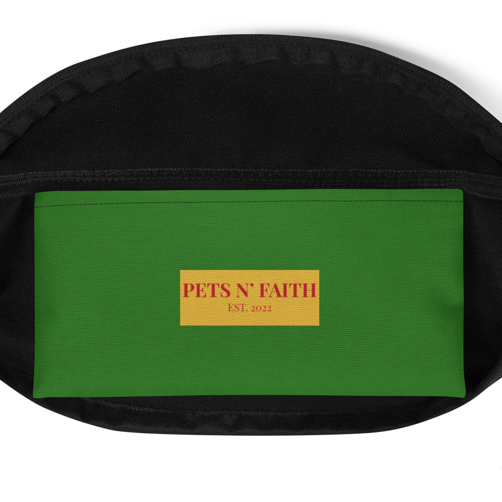 Interior view of green fanny pack featuring Pets N’ Faith Est. 2022 label in red and gold on inside pocket.