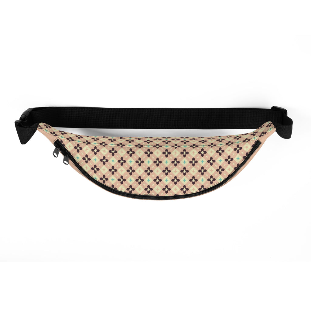 Overhead view of peach beige fanny pack featuring brown and mint green cross pattern design on the top panel.