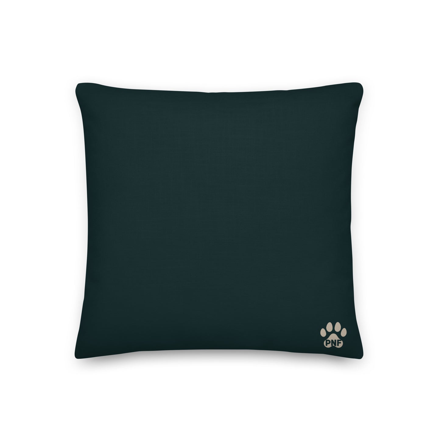 Forest green pillow with a paw print design on a beige background