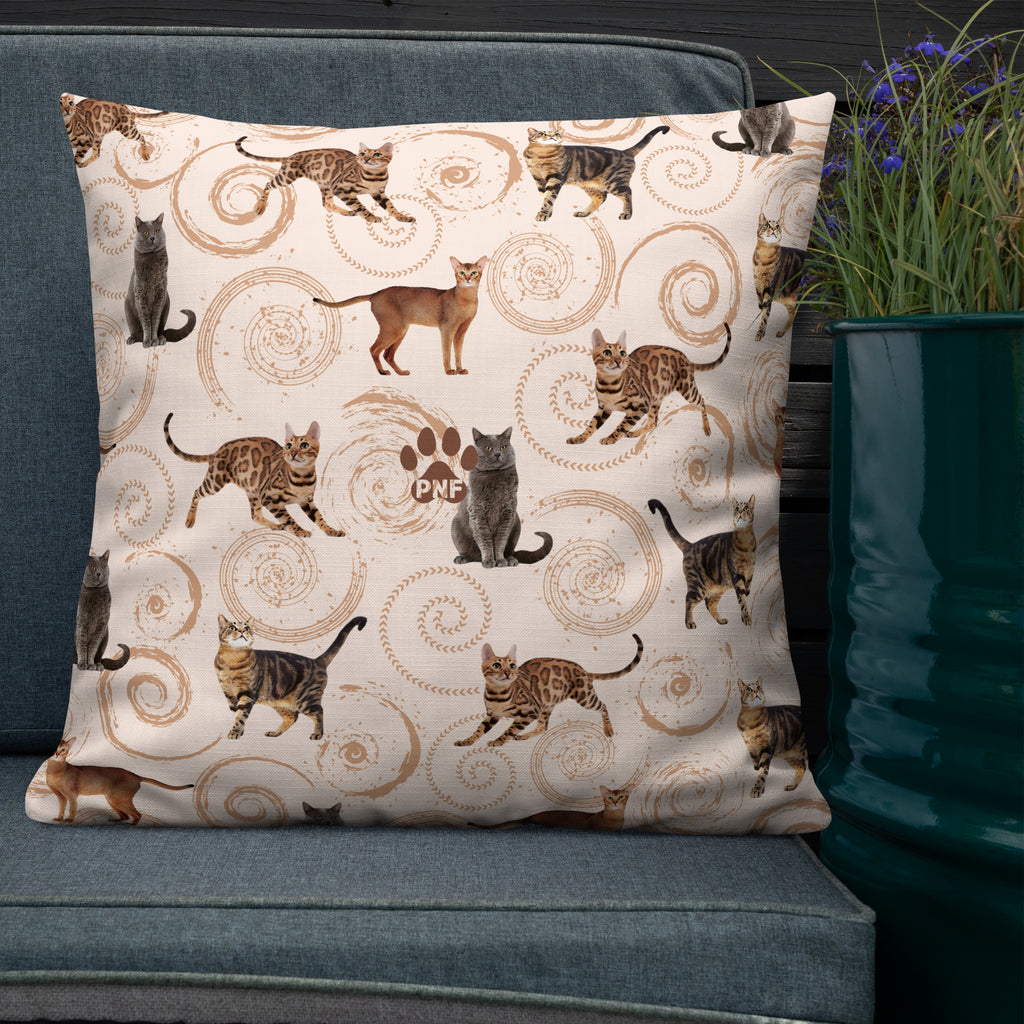 Back view of cream accent pillow featuring illustrated cats in gray, brown, and tabby patterns surrounded by spiral swirls, luxury cat lover home décor by Pets N’ Faith.