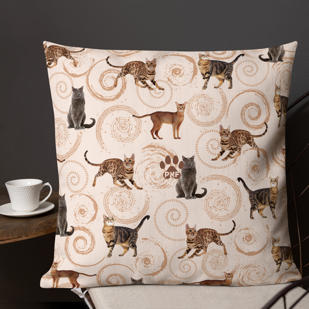 Back view of cream accent pillow featuring illustrated cats in gray, brown, and tabby patterns surrounded by spiral swirls, luxury cat lover home décor by Pets N’ Faith.