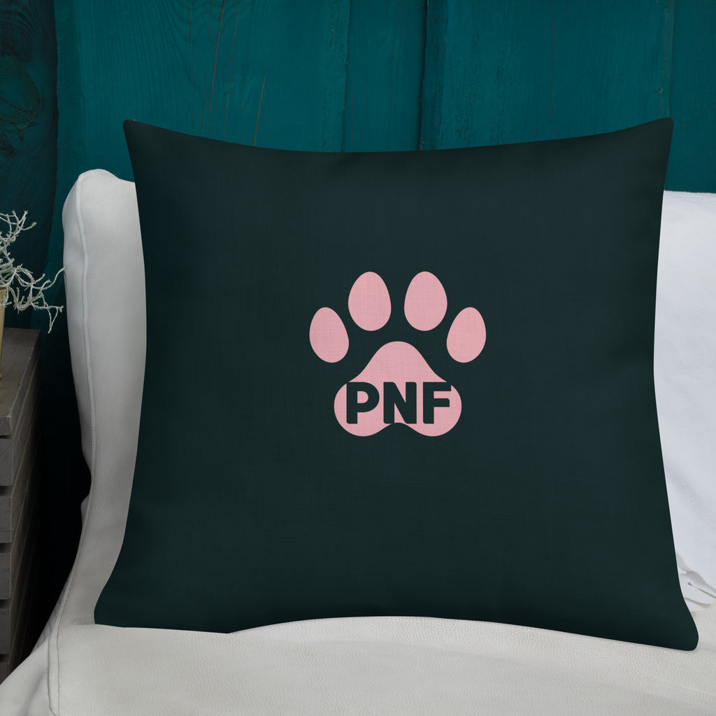 Back view of God's Little Helpers All Over Print Accent Pillow in forest green with pink accents showing the pink paw print on the back of the pillow.
