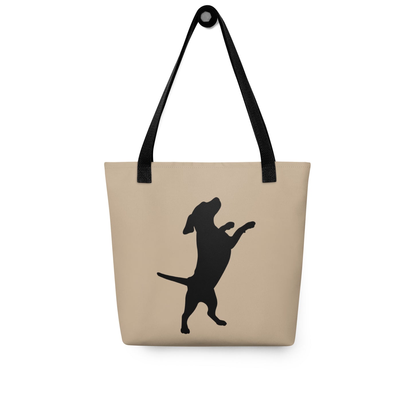 Beige tote bag with black dog silhouette and handle on a white background