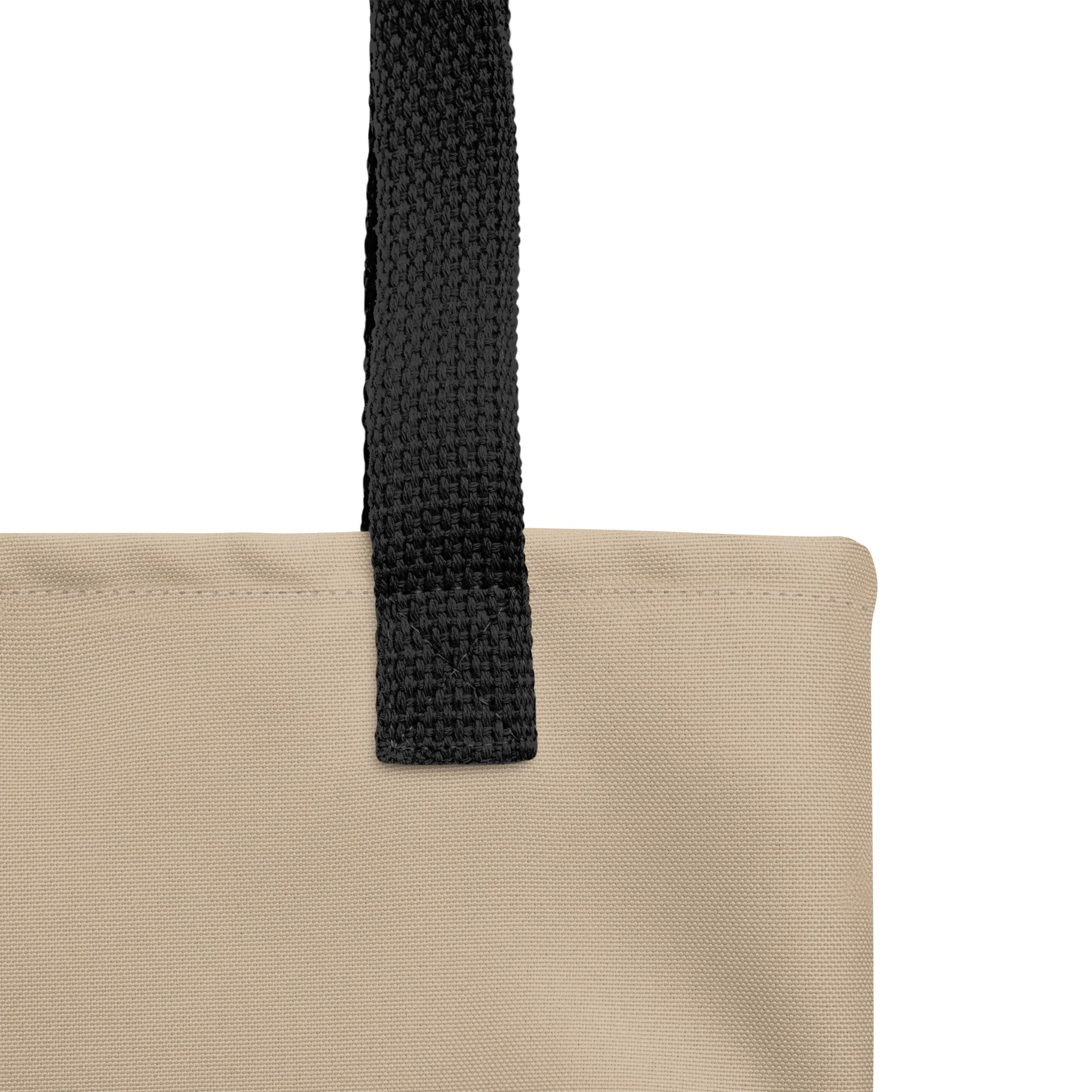 Beige tote bag with a black strap on a white background