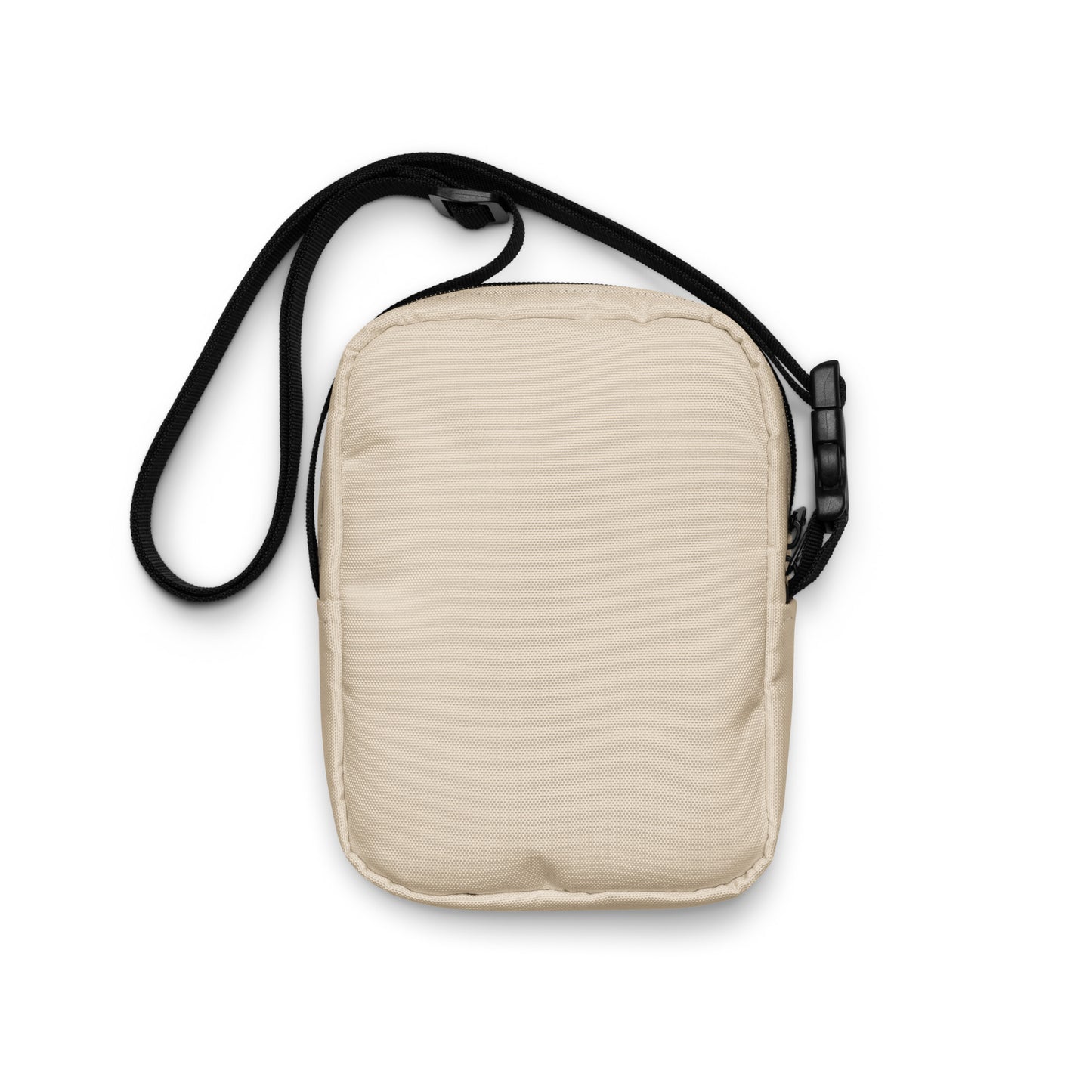 Beige crossbody bag with a black strap on a white background
