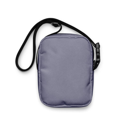 Gray crossbody bag with a black strap on a white background