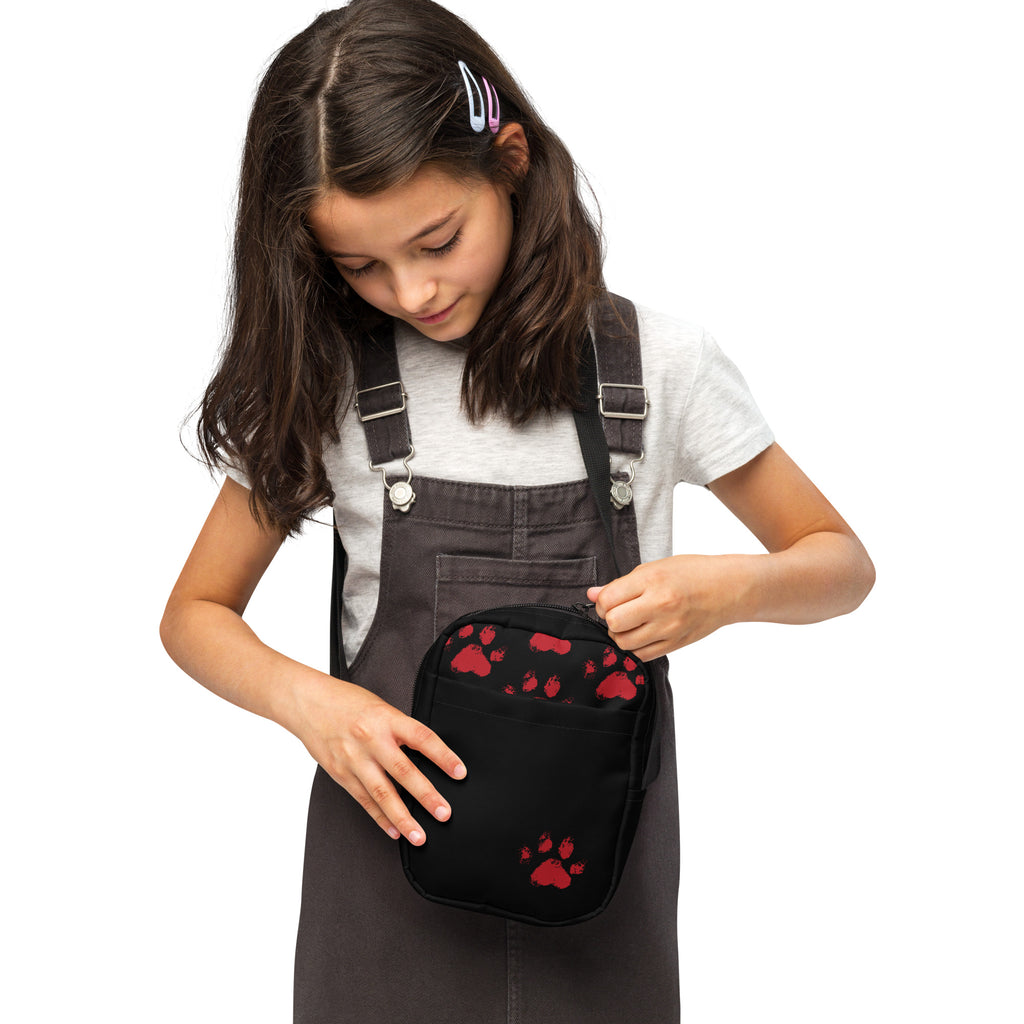Black crossbody bag with red paw prints and front pocket, Christian pet-lover design by Pets N’ Faith