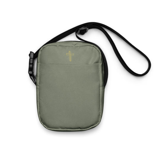 Military green crossbody bag with a gold cross on a white background