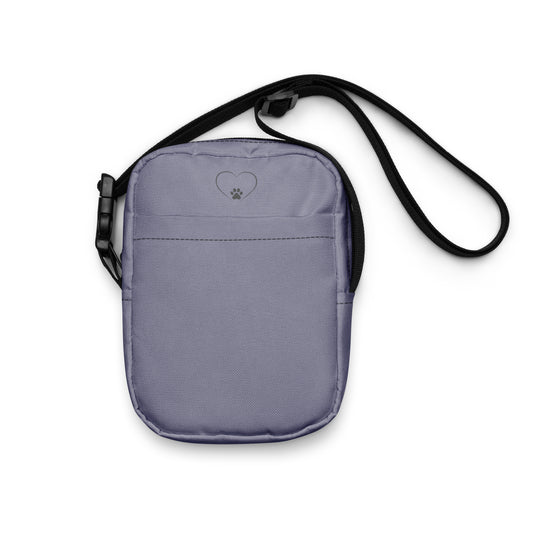 Gray crossbody bag with a black strap on a white background