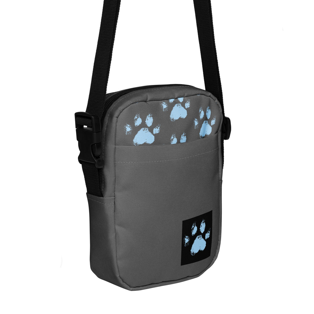 Gray crossbody bag with repeating blue paw print pattern, faith-inspired pet accessory