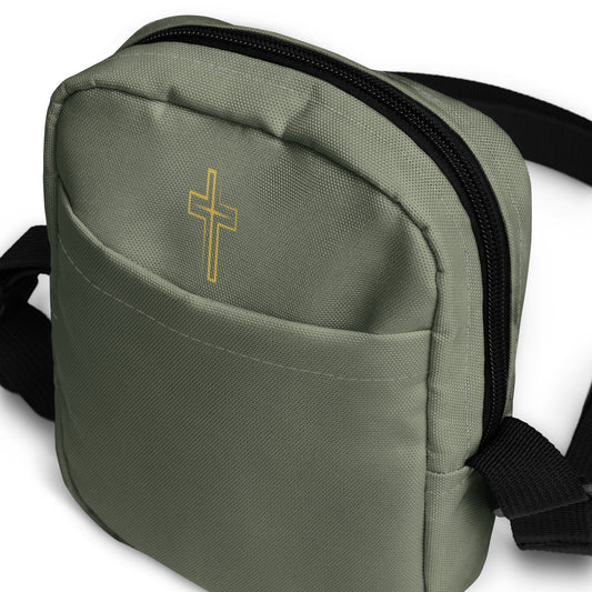 Military green crossbody bag with a gold cross emblem on a white background