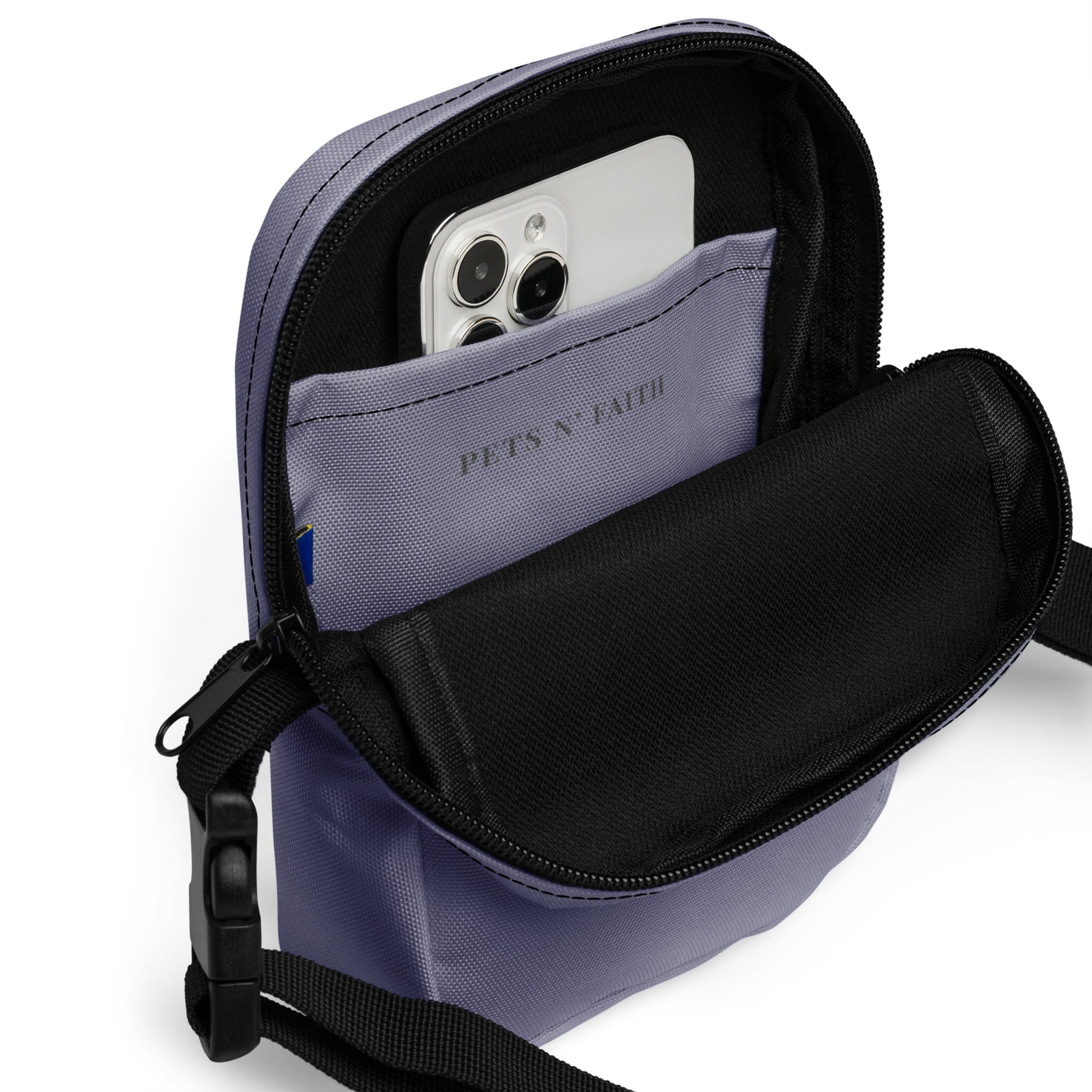 Purple crossbody bag with a phone pocket showing 'PETS N' FAITH' branding.