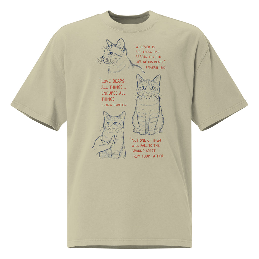 Front view of tan oversized faded t-shirt with cat illustrations and Bible verses, including Proverbs 12:10, 1 Corinthians 13:7, and Matthew 10:29, designed by Pets N Faith.