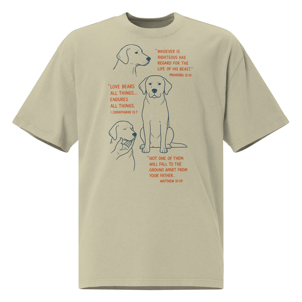 Tan oversized faded t-shirt with dog illustrations and Bible verses, including Proverbs 12:10, 1 Corinthians 13:7, and Matthew 10:29, designed by Pets N Faith.