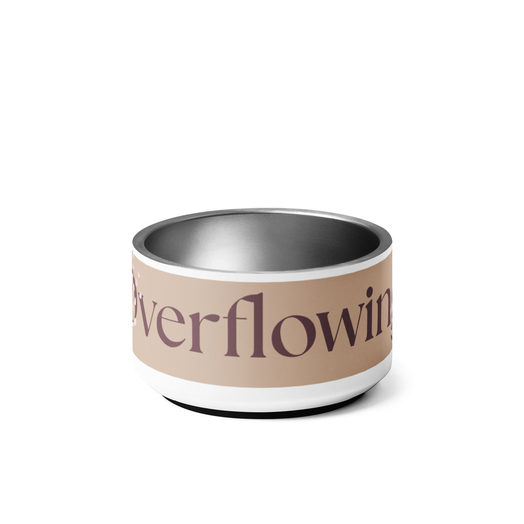 Close-up of the white stainless steel pet bowl with the words, “Overflowing” in the front and a rose petal design adorned on the sides.