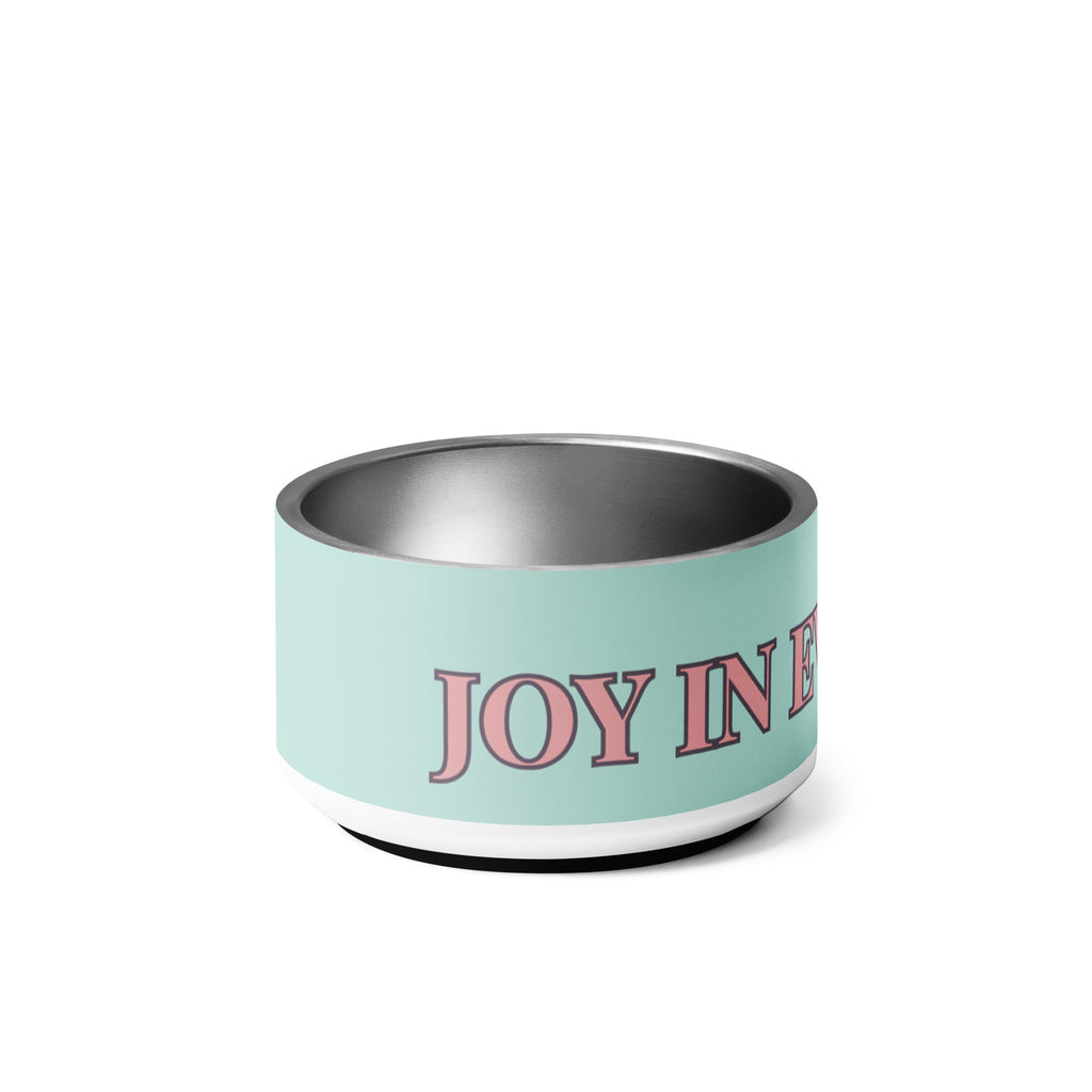 Side view of mint green pet bowl stacked on top of each other with pink and black text reading “Joy in Every Wag,” featuring a durable stainless steel interior and anti-slip rubber base.