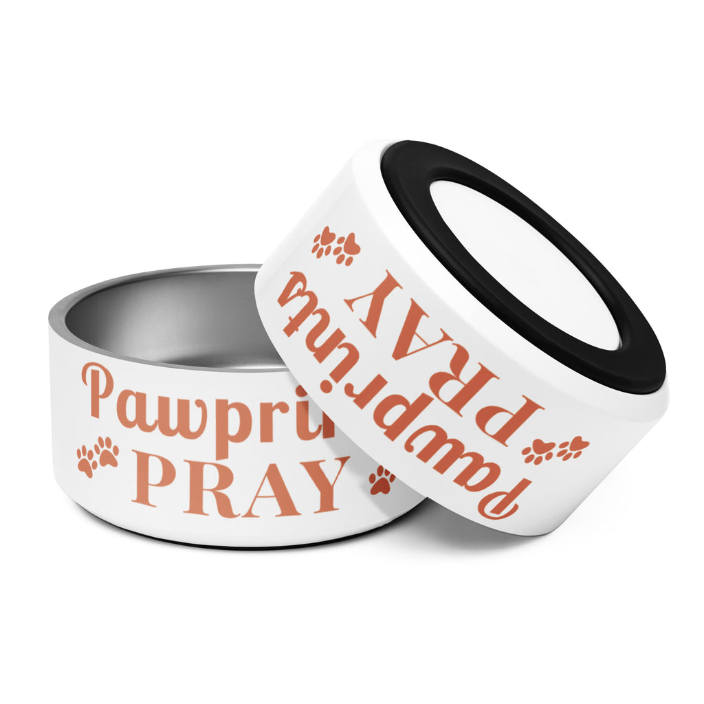 Two Pawprints Pray terracotta print stainless steel pet bowls, one upright and one tilted to show anti-slip rubber base.